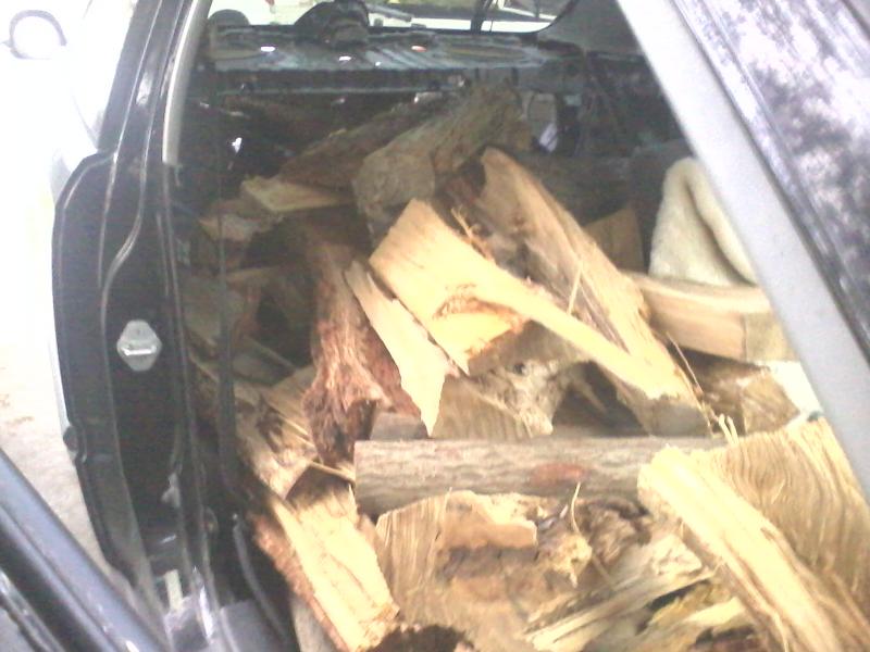 Civic as mini utility truck. One quarter cord of wood, IIRC. No passenger seat, no back seat, no linings in the back, and no spare tire. I got 60+ mpg bringing this wood home.