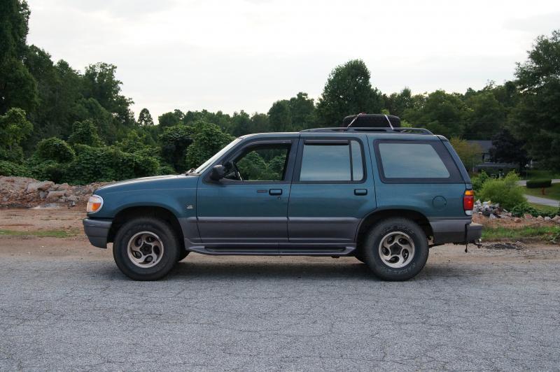 1997 Mercury Mountaineer "Beast".

The tire is on the roof because it can't fit under the truck, and I don't like an unsecured tire IN the vehicle.