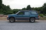 1997 Mercury Mountaineer "Beast". 
 
The tire is on the roof because it can't fit under the truck, and I don't like an unsecured tire IN the...