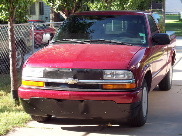 picture of first gen Frankenstein air dam and grill block
maybe there will be a prettier gen 2 - maybe not
I am now at the limits of restricting air on grill
only opening is under the bumper in the center & two slots either side the bow tie
the eletric fan will run at highway speed with this set up
opened up the center slot a few square inches & it stays cool in cruise now.