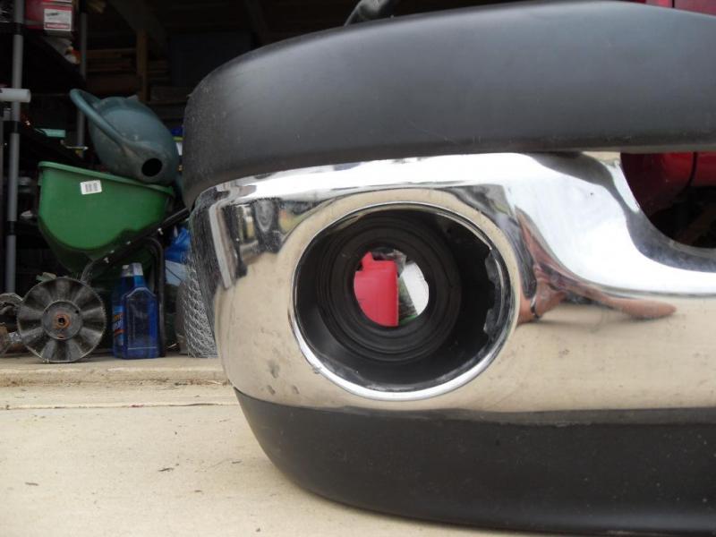 View of the bumper from the from with the boot attached and the stock fog lamp hole grille removed so you can see better.