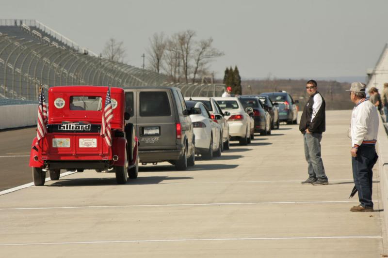 Cars entering the track one at a time.