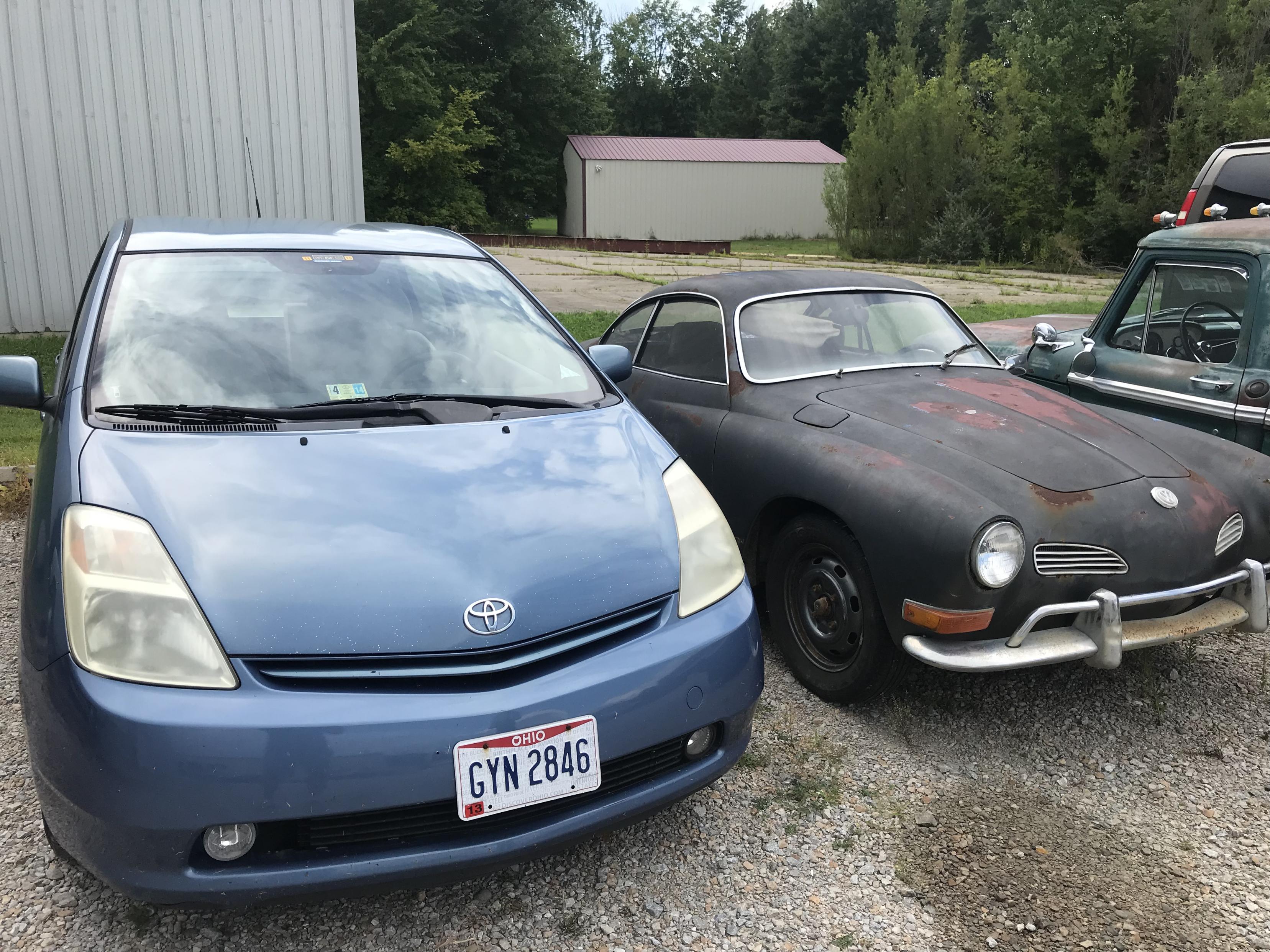 2004 Toyota Prius and a 1971 Volkswagen Karmann Ghia