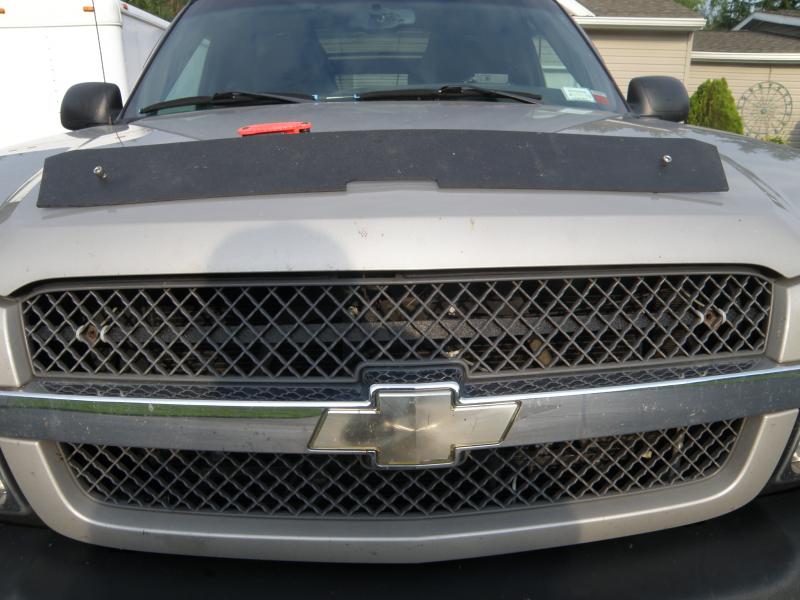 Grill block support mounts behind grill.  Easy removal with 2 stainless allen bolts into nut clips on thin ABS piece that I zip tied to the grill.