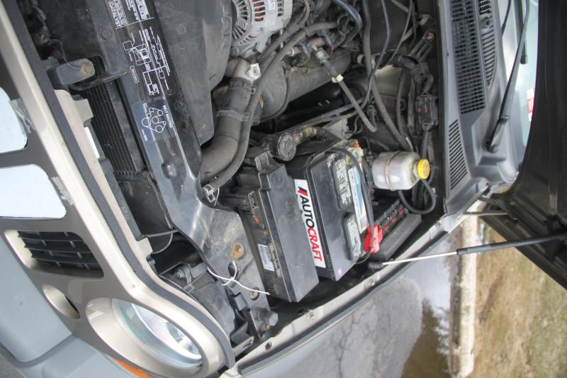 weather stripping across the top of the grille, blocks air from entering between the grille and hood and flowing out the bottom of the engine compartment taking heat with it.