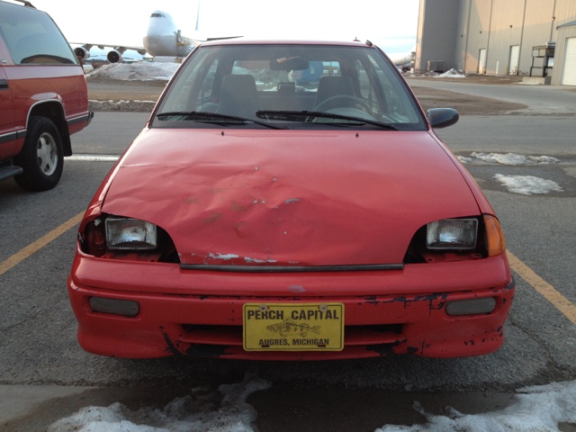 The 1992 Geo Metro.  This is after I hit a deer with the Left Front.  Smashed the hood a bit.  I straightened it by jumping up and down on it, after taking it off and laying it in the yard.  Seems ok.