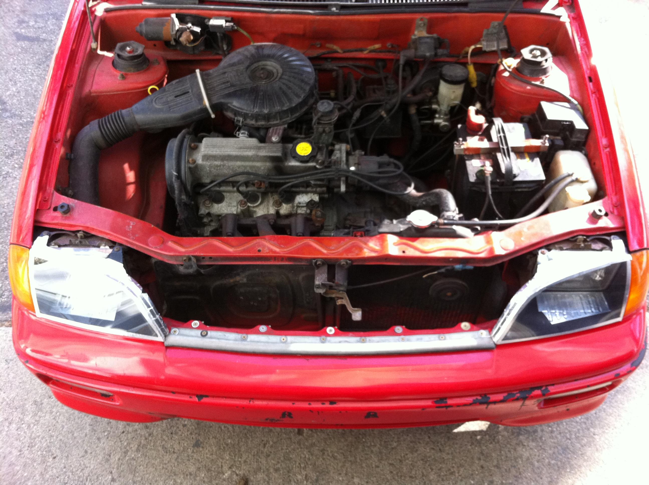 Another shot of my "aero" headlight covers.  I also addes a bulb seal across the lower lip of the hood mating area.  Closing up the gap there.