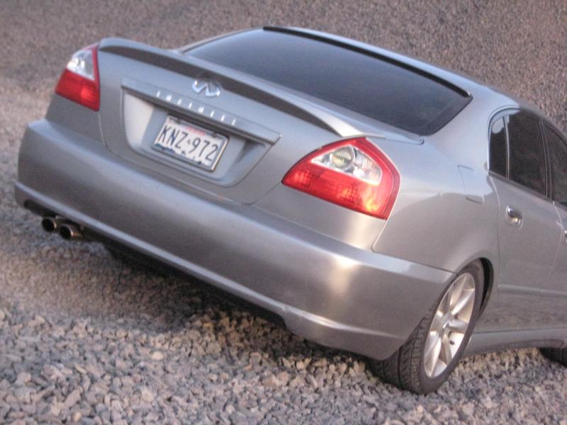 SUMMER 2007:
2002 Q45 w/ IMPUL full body kit. Rear view. Factory rear spoiler and custom lip spoiler