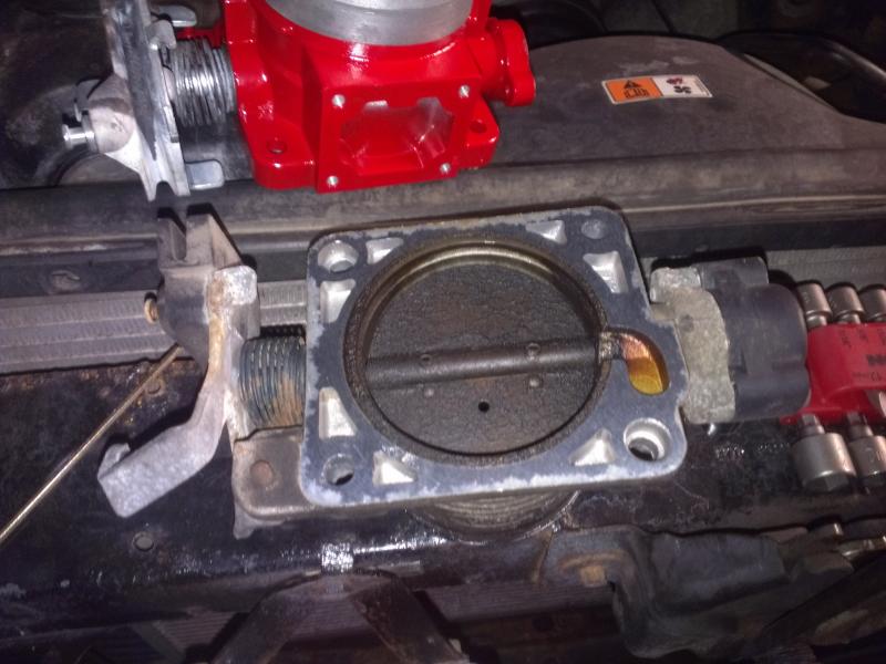 Stock 65mm throttle body. The dirt ring shows that the intake is 70 mm.