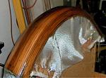 The is the beginning of a new front fender.  The fiberglass cloth is covering the cedar strip fender.  Epoxy resinturns the cloth transparent. It...