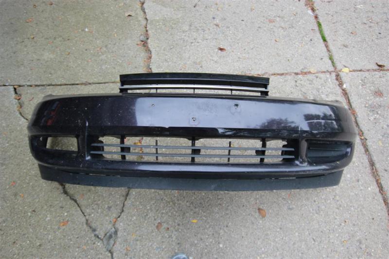 Stock bumper cover. I don't know how long I've been missing the passenger side fog lamp cover.