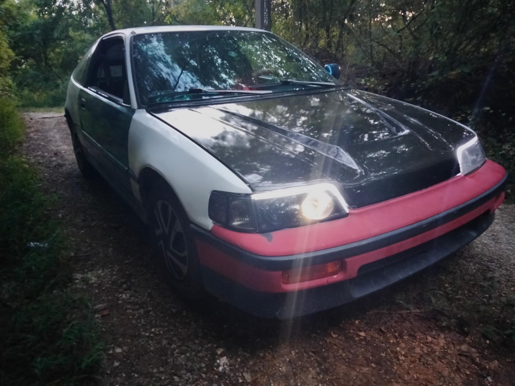 New carbon fiber hood I picked up for $150 and traded with a friend to sand and clear coat for me cause it was in terrible shape when I got it. still has stress cracks, scratches, etc. but looks much better.