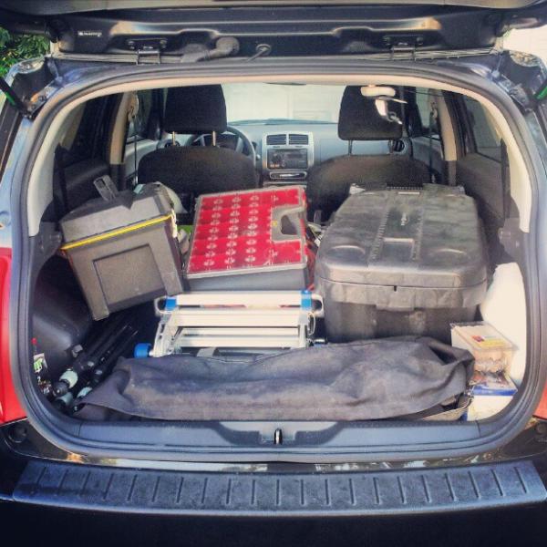 Here's a photo of my Scion xD loaded up for a typical day of work. This particular day I was setting up multiple time lapse cameras at a construction site. I used to drive an F-150 pickup with a hard cover on the bed. Rear seats? What rear seats? My car came with rear seats?